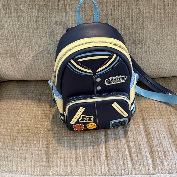 Disney Monsters University varsity jacket Navy and Cream Backpack 10 x 8 - Picture 2 of 10